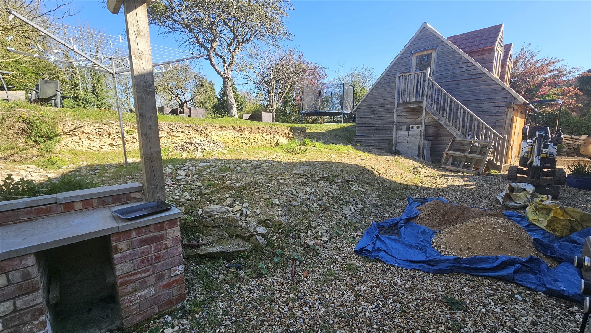 Ropsley garden and outbuilding before landscaping