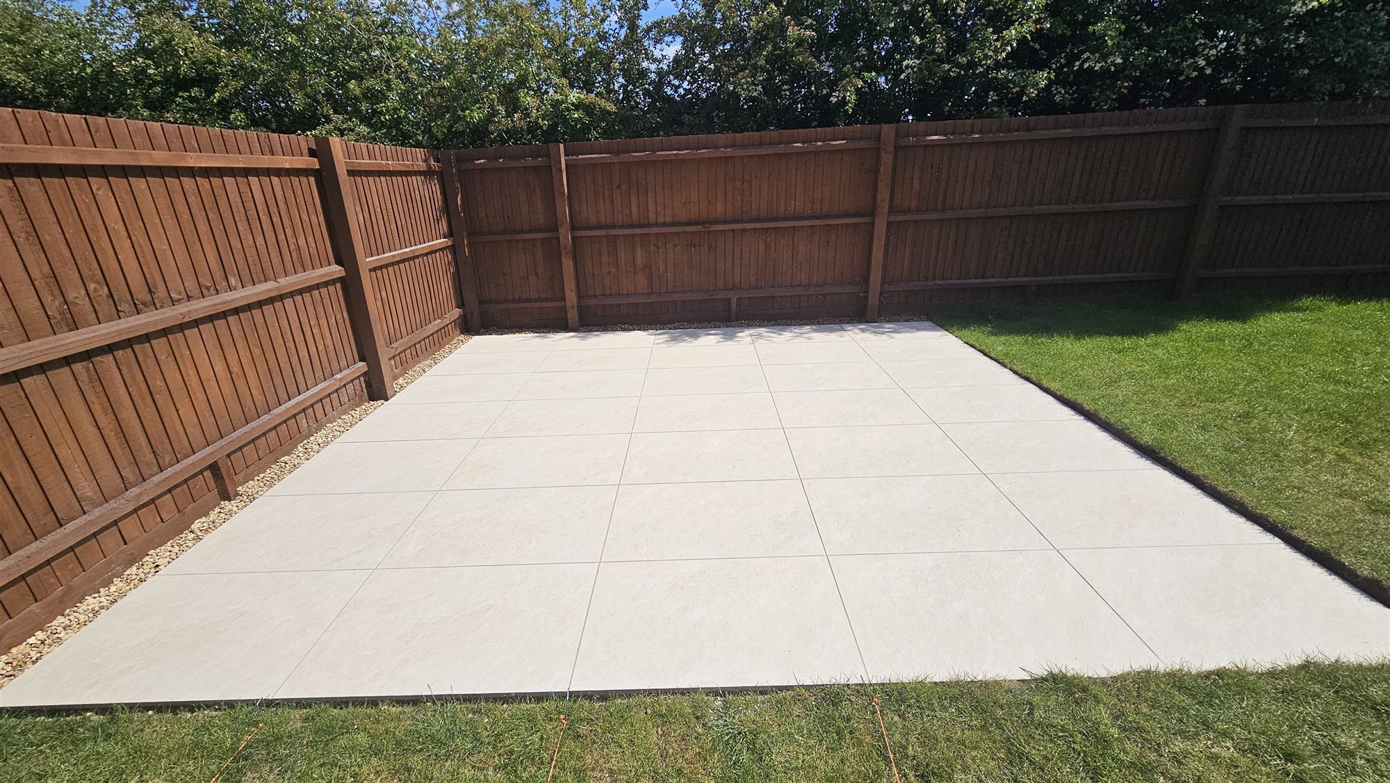 Completed porcelain patio seating area in Corby Glen