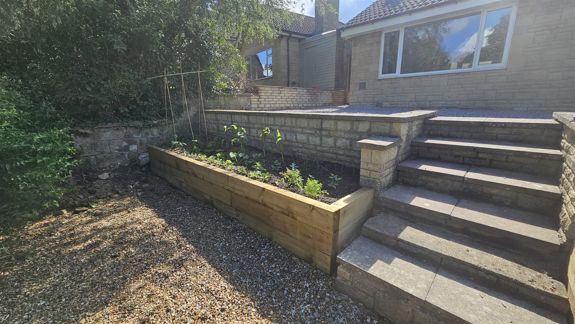 Raised beds, gravel and renewed garden steps after completion