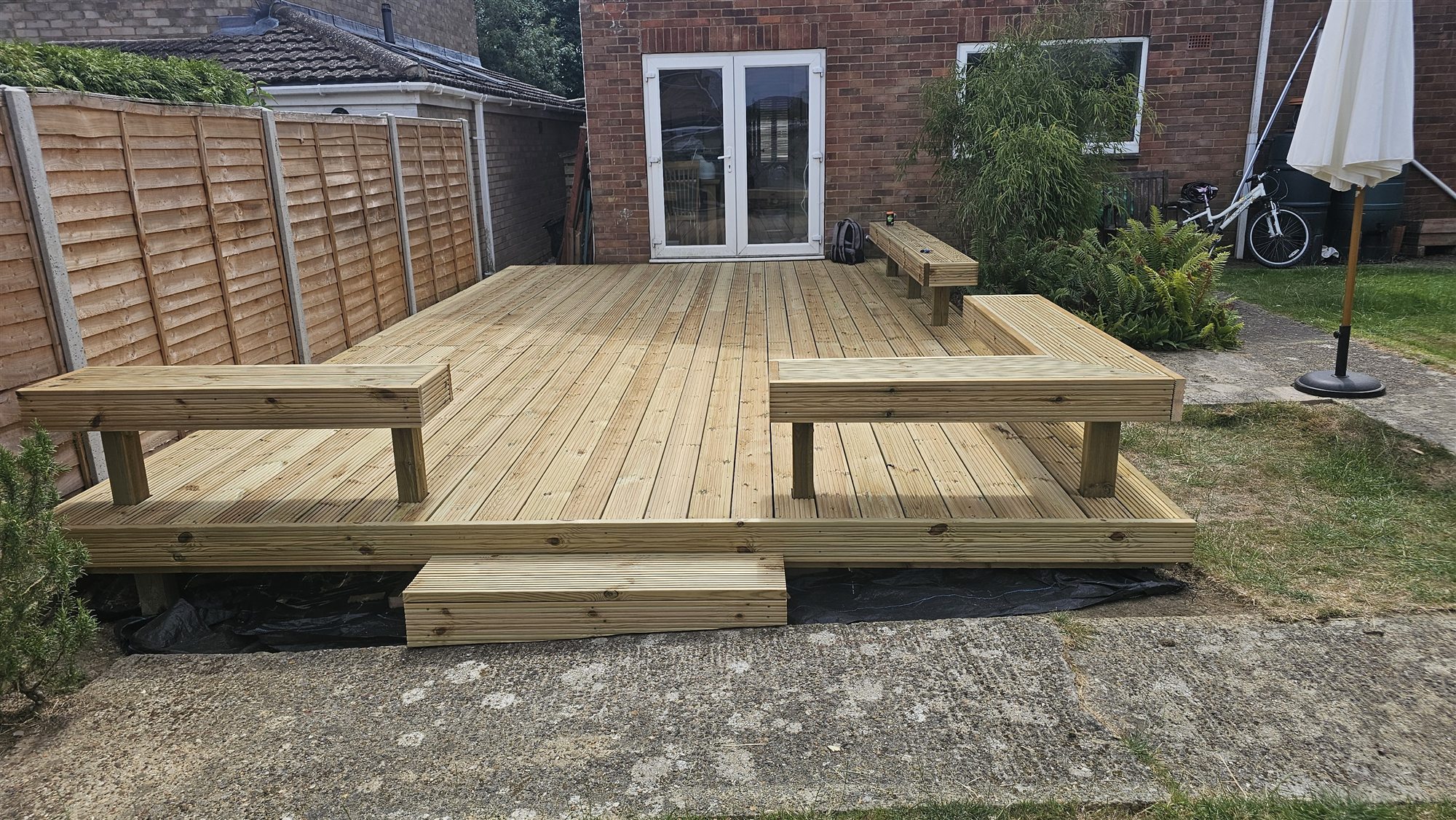 Completed timber decking and built-in seating in Oakham